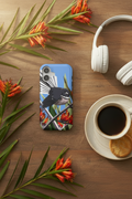 Pīwakawaka in Harakeke iPhone case flat lay